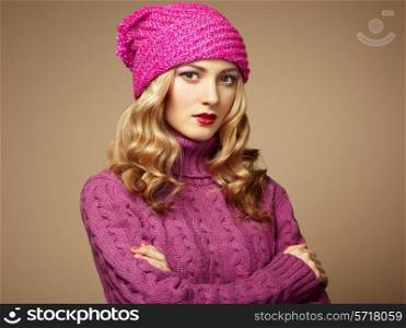 Fashion photo of beautiful woman in sweater. Curly hairstyle. Make-up. Autumn portrait