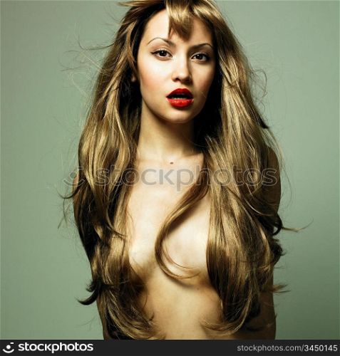 Fashion photo of beautiful woman with magnificent hair