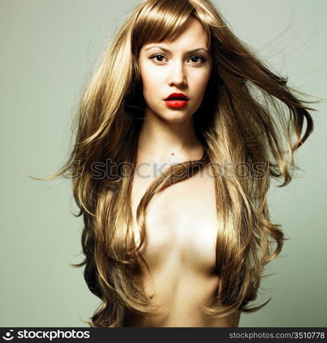 Fashion photo of beautiful woman with magnificent hair