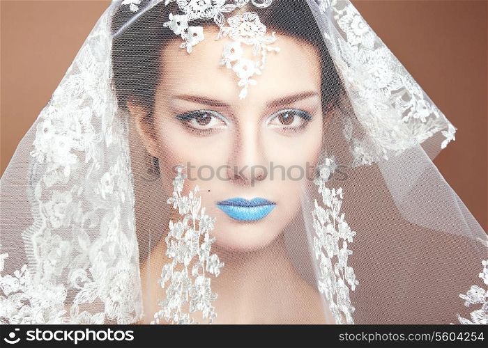 Fashion photo of beautiful women under white veil. Beauty portrait