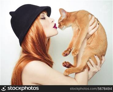 Fashion photo of elegant lady with Abyssinian cat