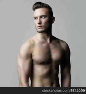 Fashion photo of naked male with strong body