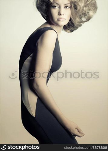 Fashion photo of young lady in elegant black dress