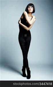 Fashion photo of young long-legged woman