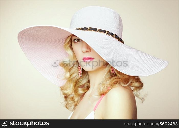 Fashion photo of young magnificent woman in hat. Girl posing. Studio photo. Blonde woman. Perfect Makeup