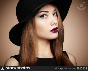 Fashion photo of young magnificent woman in hat. Girl posing. Studio photo. Perfect Makeup