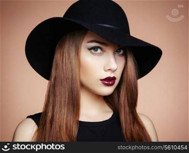 Fashion photo of young magnificent woman in hat. Girl posing. Studio photo. Perfect Makeup