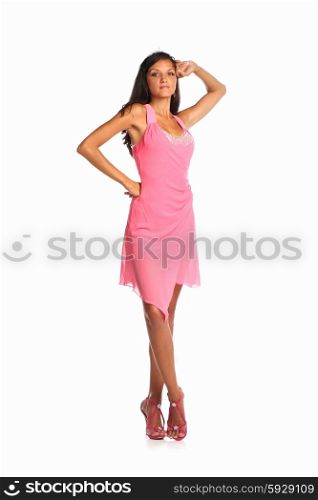 Fashion photo of young magnificent woman in pink dress. Studio photo