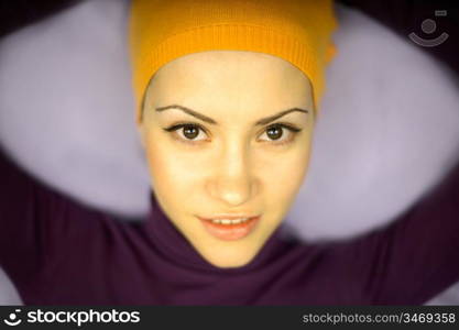 Fashion photo of young woman in orange bandage