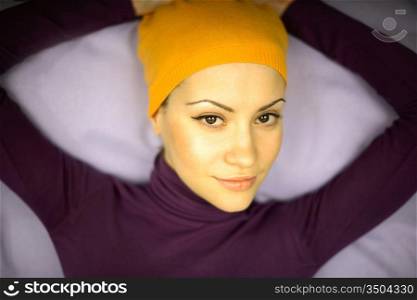 Fashion photo of young woman in orange bandage