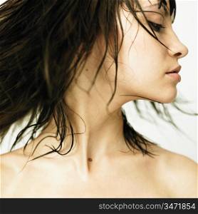 Fashion photo. Profile of woman with developing hair