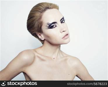 Fashion photography of beautiful young girl with fantasy makeup