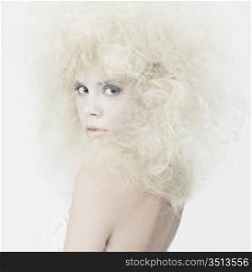 Fashion photography of beauty young blonde with fantasy makeup