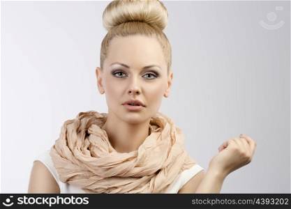 fashion portarit of blond nice girl with white dress and up hair style and summer scarf sweet color
