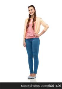 fashion, portrait and people concept - happy smiling young woman in cardigan and jeans. happy smiling young woman in cardigan and jeans