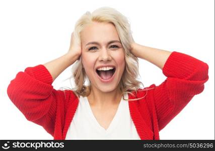 fashion, portrait and people concept - happy young woman in red cardigan holding her head and laughing. happy young woman holding her head and laughing