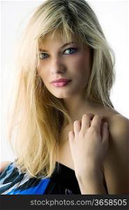 Fashion portrait of a beautiful girl with blond long hair no well brushed
