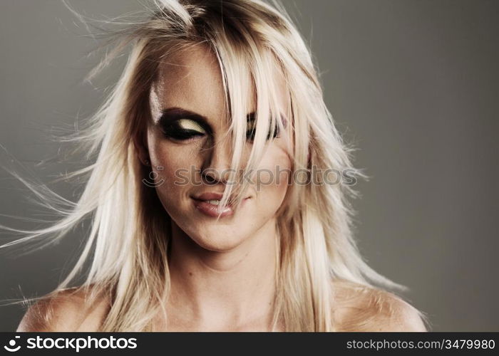 fashion portrait of a woman on a gray background