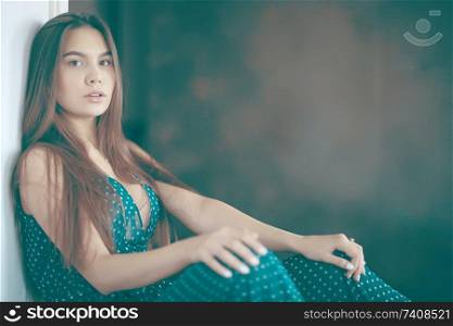 Fashion portrait of a young beautiful adult brunette girl