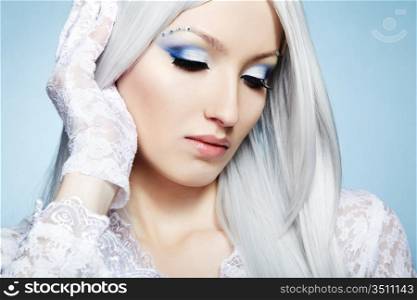 Fashion portrait of a young beautiful blonde woman. Winter Makeup