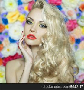 Fashion portrait of beautiful blonde on flower background