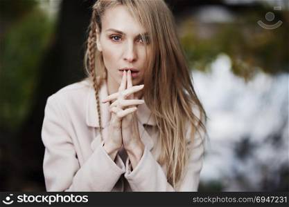Fashion portrait of beautiful blonde woman in stylish clothes outdoor in autumn.. Fashion portrait of beautiful blonde woman in stylish clothes outdoor in autumn