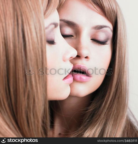 Fashion portrait of beautiful girl in front of the mirror