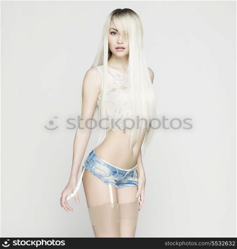Fashion portrait of beautiful sexy blonde in jeans short