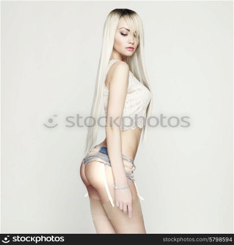 Fashion portrait of beautiful sexy blonde in jeans short