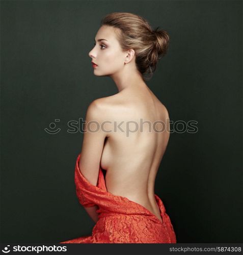 Fashion portrait of beautiful woman in elegant red dress. Hair and hairstyle. Beauy vintage style