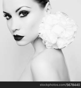 Fashion portrait of beautiful young lady with peony