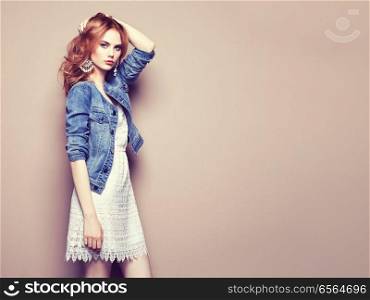 Fashion portrait of beautiful young woman in a summer dress. Beauty spring photo
