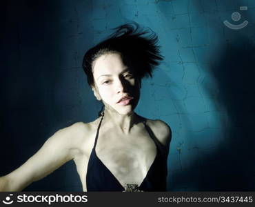 Fashion portrait of beautiful young woman in the water