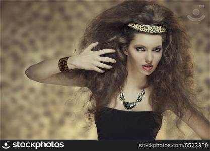 fashion portrait of cute brunette girl with curly hair-style, cute make-up and leopard accessories