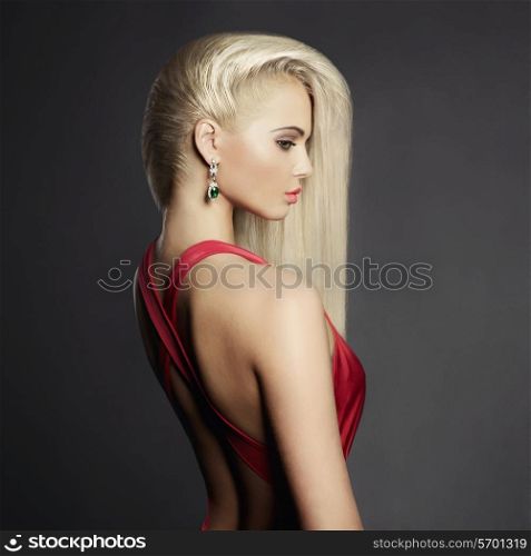 Fashion portrait of elegant blond woman in red dress
