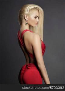 Fashion portrait of elegant blond woman in red dress