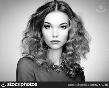 Fashion portrait of elegant woman with magnificent hair. Blonde girl. Perfect make-up. Black and white