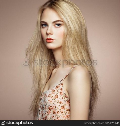Fashion portrait of elegant woman with magnificent hair. Blonde girl. Perfect make-up. Hairstyle