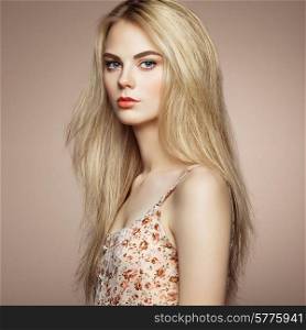 Fashion portrait of elegant woman with magnificent hair. Blonde girl. Perfect make-up. Hairstyle