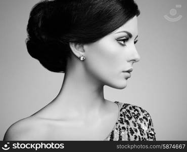 Fashion portrait of elegant woman with magnificent hair. Brunette girl. Perfect make-up. Black and white