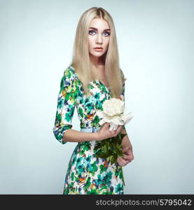 Fashion portrait of elegant woman with summer flowers. Blonde girl. Perfect make-up. Hairstyle. Summer dress. Peonies