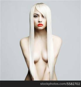 Fashion portrait of nude elegant woman with helthy luxurious hair