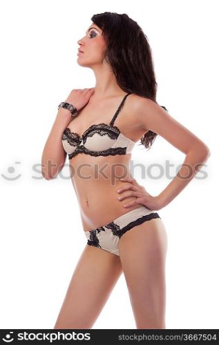 fashion portrait of pretty and sexy girl in light lingerie with long hair and jewellery