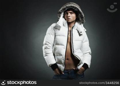Fashion portrait of the young beautiful man in a white jacke