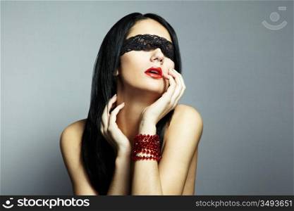 Fashion portrait of the young woman blindfold
