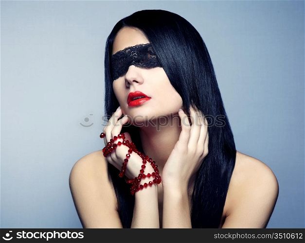 Fashion portrait of the young woman blindfold