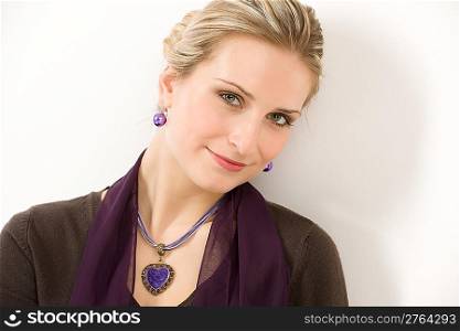 Fashion portrait of woman in designer clothes looking at camera