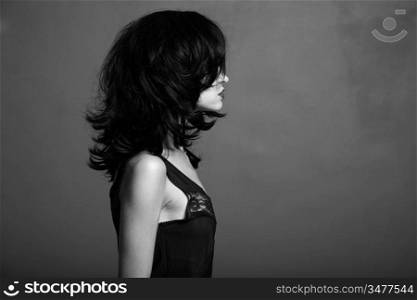 Fashion portrait of young attractive lady. Black and white photo