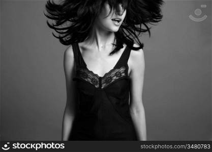 Fashion portrait of young attractive lady. Black and white photo