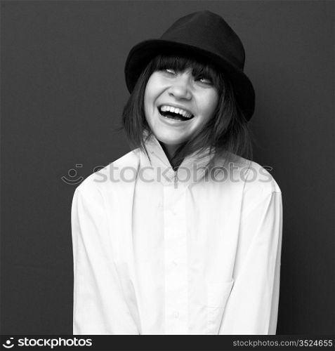 Fashion portrait of young attractive lady in hat